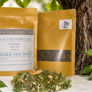 May include: Two brown paper pouches containing dried Guinea Hen Weed herbs. The front label reads HD-ACCESS HERBAL LIFE, Dried holistic herbs from Jamaica, GUINEA HEN WEED, 1 oz/28 g, and SELF-IMPROVEMENT INSIDE-OUT. A pile of loose dried herbs sits in front.