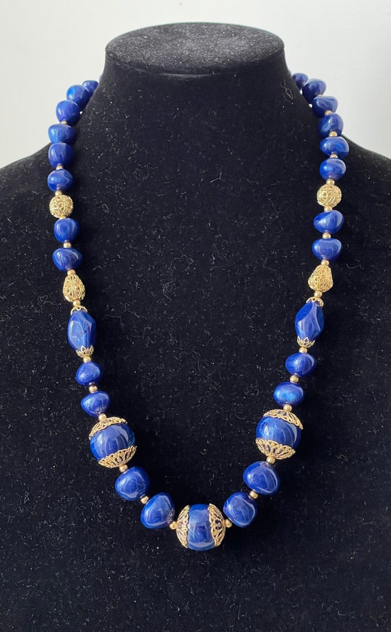 Trifari TM blue plastic, gold plated filigree bead