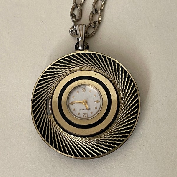 Caravelle Pendant watch wind up see thru back