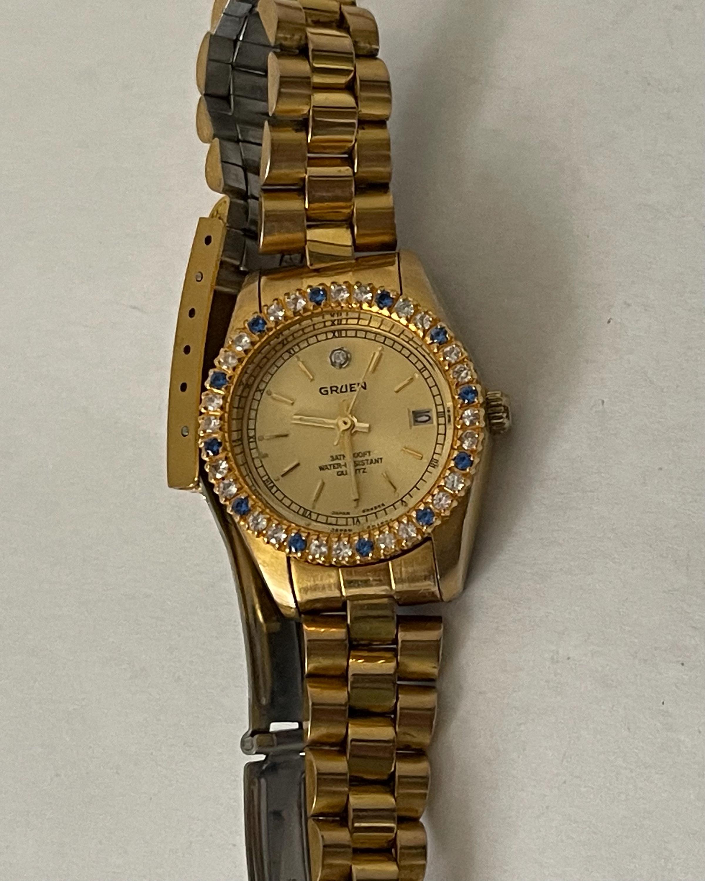 GRUEN Ladies Quartz Watch With Blue and Clear Crystals. Gold Tone