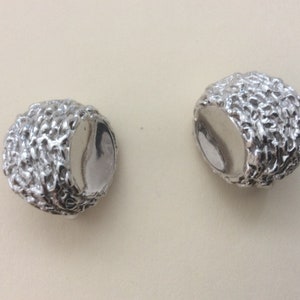Trifari textured and shiny silver plated clip-on earrings