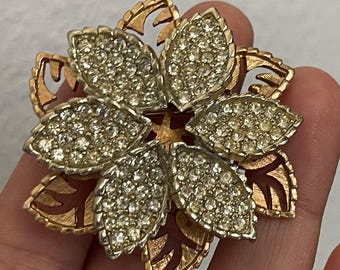 Clear rhinestone gold, silver plated flower brooch pin. Cut out design