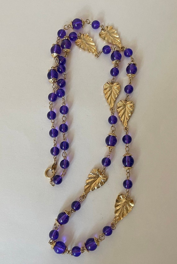 Trifari TM Purple Lucite plastic necklace with gol