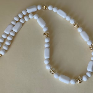 Trifari TM  White plastic, clear plastic lucite  gold tone filled beads necklace