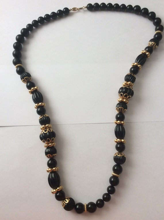 Trifari TM black plastic melon beads, round beads,