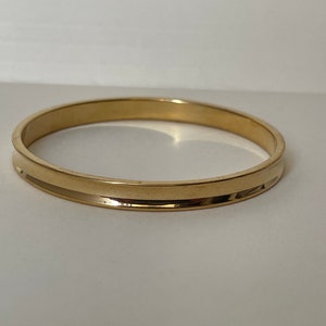 Monet Concave  gold plated bangle bracelet. Diameter 2 5/16&quot; Small
