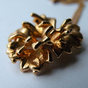 Leaf gold plated metal pendant with chain