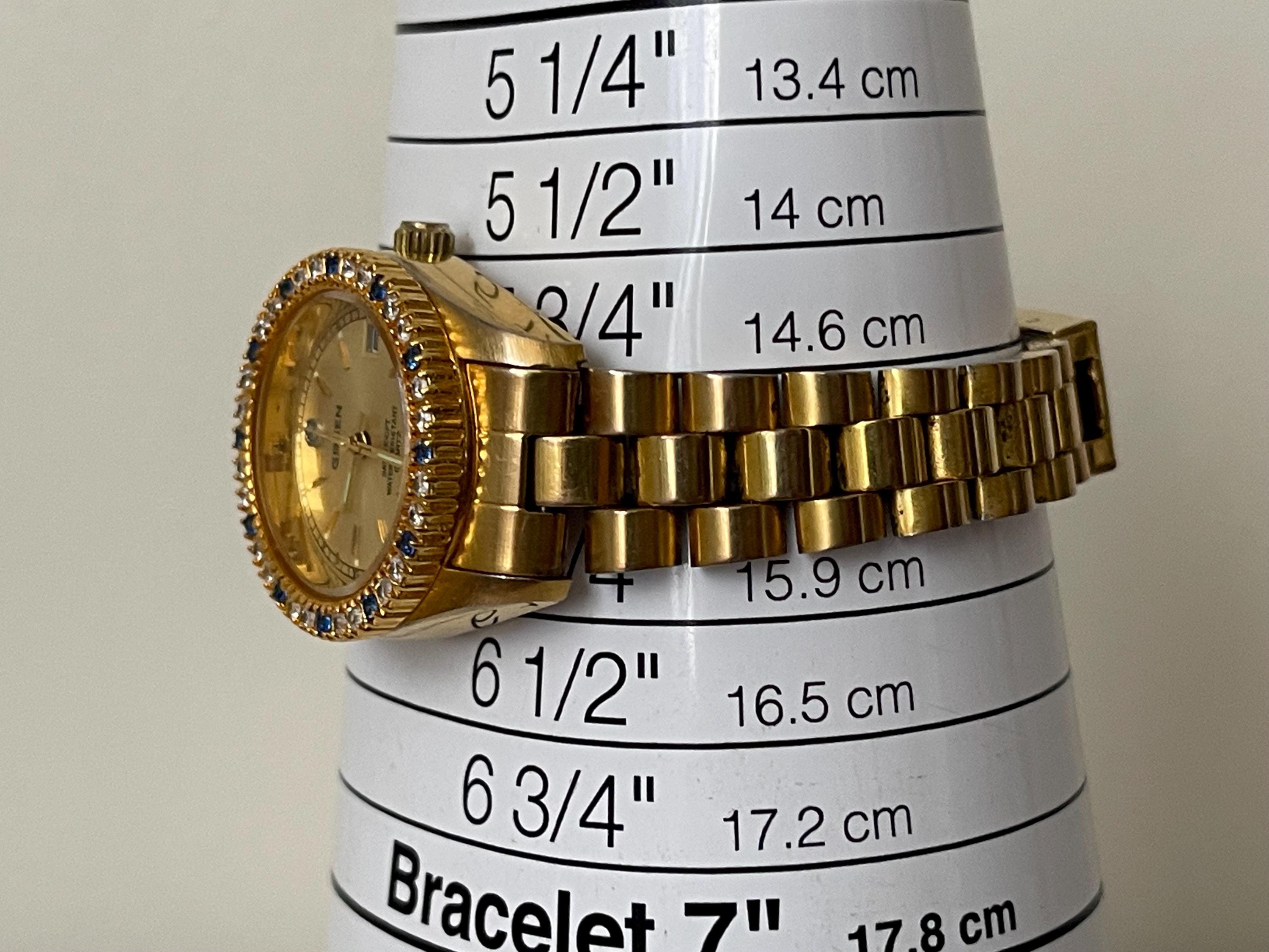 GRUEN Ladies Quartz Watch With Blue and Clear Crystals. Gold 
