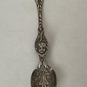 Antique Whiting sterling silver  child face, baby face spoon. Demitasse spoon