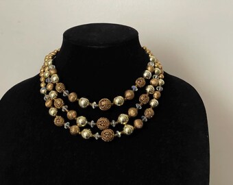 Lisner three strand gold tone necklace, filigree, open work beads, crystal beads necklace
