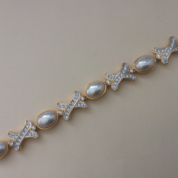 Nolan Miller XO XO X-link bracelet. Faux pearl, clear rhinestone.