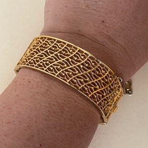 Corocraft gold plated filigree, open work bangle, hinged   bracelet