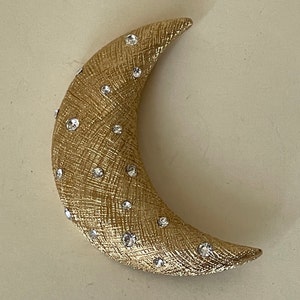 Christian Dior clear rhinestone half moon, moon textured gold plated metal  brooch