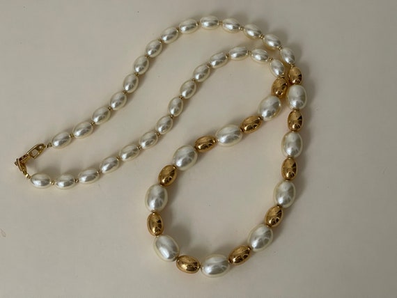 White and Golden Pearl necklace looks elegant and high -white pearl colour