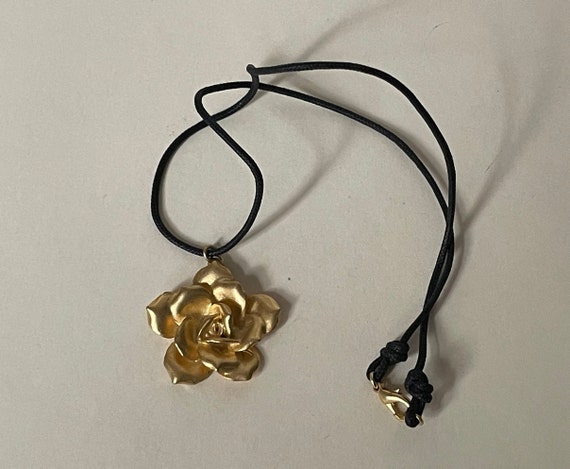 Matte gold, satin gold rose pendant, black cord