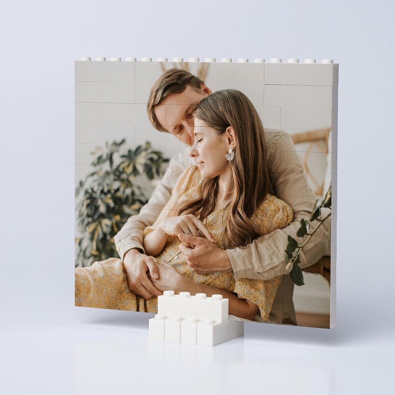 May include: A set of three ceramic mugs with a speckled, matte finish. The mugs are in shades of cream, light gray, and dark gray. Each mug has a simple, minimalist design and a rounded handle.