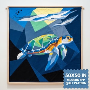 May include: A wall-hanging quilt featuring a geometric sea turtle in shades of green, blue, and orange against a dark blue background with abstract light rays. The text "Floweria Studio" and "50X50 IN MODERN FPP QUILT PATTERN" are visible.