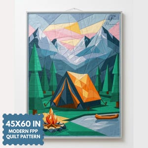 May include: A fabric quilt wall hanging featuring a geometric landscape with a tent, campfire, and canoe. The scene includes green pine trees, blue mountains, and a pink and yellow sky. Text reads 45X60 IN MODERN FPP QUILT PATTERN.