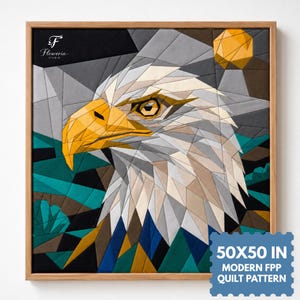 May include: A square quilt pattern featuring a geometric eagle head in shades of white, gray, and yellow, set against a teal and black background. The text "50X50 IN MODERN FPP QUILT PATTERN" is visible in the corner of this framed textile art piece.