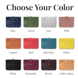 May include: A range of leather laptop sleeves in colours such as blue, green, grey, pink, cognac, red, light blue, yellow, black, burgundy, brown, and light cognac. Each sleeve features a buttoned flap closure.