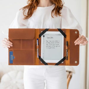 May include: A trio of ceramic mugs with a speckled, matte finish in cream, light grey, and dark grey. Each mug features a simple, minimalist design, ideal for tea or coffee.