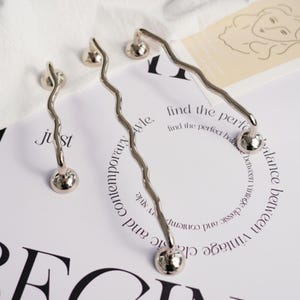 silver-colored WIGGLE brass handles/Solid brass handles/wavy cabinet handles/curved cabinet handles/Polished Nickel Cabinet pulls