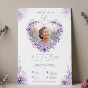 Puede incluir: Una tarjeta de invitación funeraria con una corona de flores moradas en forma de corazón que rodea el retrato de una persona mayor. El texto dice: You are invited to a celebration of life, In loving memory of Amelia Rose Castillo.