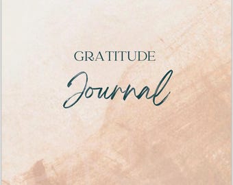 May include: A journal with a soft, abstract background in shades of beige and peach. The words "GRATITUDE Journal" are written in elegant, dark teal script. The design features a subtle floral pattern in the lower corner.