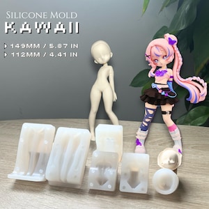 May include: Silicone mould set for Kawaii figures. The set includes moulds for a doll body and head, along with a finished doll. The text on the image reads "SILICONE MOLD KAWAI". The doll is 14.3 cm tall.