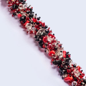 Hand Beaded Bracelet with Red, Black and Clear Glass Beads and Magnetic Closure. Easy to wear and perfect year round. Lightweight and easy.