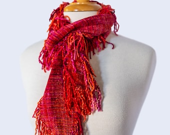 Handwoven Chenille Scarf with Fringes All Around in Sunset Colors. Rosy Red, Orange, Pink, and Fuchsia Chenille Scarf. Vegan - Easy Care.
