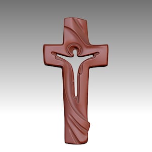 May include: A brown cross pendant with a stylized design. The cross features an open center with a figure, and carved details. The pendant is a religious symbol.