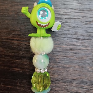 Bolígrafo de cuentas con figura de Mike Wasowski