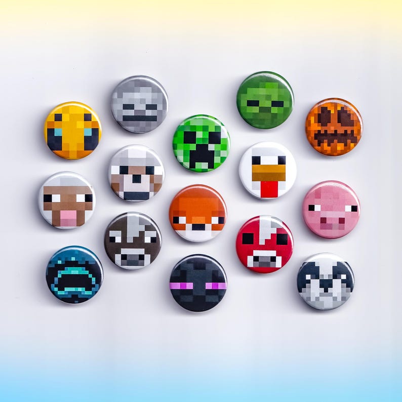 May include: A collection of round, colorful buttons featuring pixelated designs inspired by the video game Minecraft. The buttons showcase various characters and creatures, including a Creeper, pig, and Enderman. The buttons are arranged on a white surface.