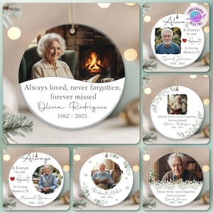 May include: A collection of memorial ornaments with photos and text. The ornaments feature images of people, with text such as "Always loved, never forgotten, forever missed" and names with dates. The ornaments are round and have a gold string for hanging.