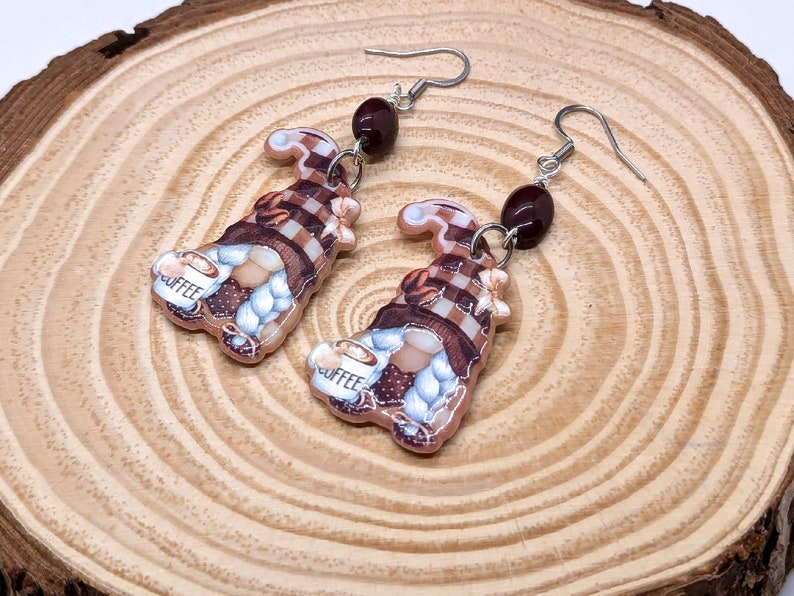 Coffee Bean Gnome Earrings on wood grain background