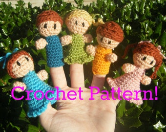 May include: Five crocheted finger puppets, each with a different color outfit and hair. The puppets are on a hand, with the text "Crochet Pattern!" below them.