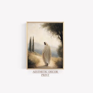 May include: Framed print featuring a figure in a white robe walking on a path. The artwork has a soft, painterly style with a muted color palette. The text "Aesthetic Decor Print" is at the bottom.
