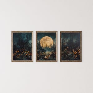 Puede incluir: Tres impresiones artísticas enmarcadas que representan una escena de bosque iluminada por la luna. La impresión central presenta una gran luna brillante sobre árboles silueteados. Las otras dos impresiones muestran escenas de bosque similares.