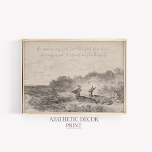 Könnte beinhalten: Ein gerahmter Druck mit einer sepiafarbenen Landschaft, die zwei Hirsche in der Nähe eines Gewässers zeigt. Das Kunstwerk enthält den Text "He makes my feet like the feet of a deer, he causes me to stand on the heights" und "Psalm 18:33". Die Worte "Aesthetic Decor Print" stehen unten.