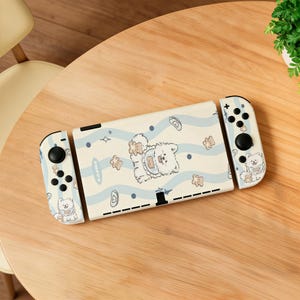 Scocca per Switch con motivo cucciolo di Samoiedo azzurro ondulato, realizzata in PC+TPU stampato in 3D per NS/ OLED/ NS2