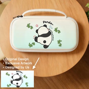 May include: A white and light blue carrying case with a panda illustration. The panda is black and white with a curved line indicating movement. The case has a handle and a zipper closure. The word "Panda" is written above the panda.