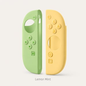 Könnte beinhalten: Ein Paar Controller-Schutzhüllen aus Silikon in Hellgrün und Blassgelb. Die grüne Hülle zeigt ein Steuerkreuz, eine Minus-Taste und ein quadratisches Symbol. Die gelbe Hülle enthält A-, B-, X-, Y-Tasten, ein Pluszeichen, ein Home-Symbol und ein C-Symbol. Lemon Mint.