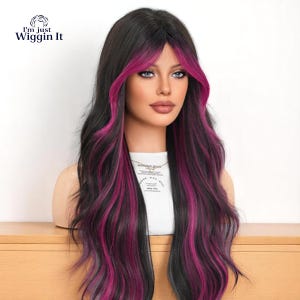 May include: A long, wavy wig with black hair and vibrant pink highlights. The wig has a middle parting and a natural-looking hairline. The text "I'm just Wiggin It" is in the upper left corner.