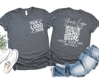 May include: Two gray t-shirts with white text and a QR code. One shirt has "YOUR LOGO HERE" printed on the front. The other shirt has "Your Logo" and a QR code with "YOUR WEB URL DETAILS" printed on the back. A pair of jeans and white sneakers are in the image.