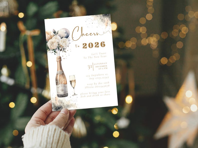 May include: A New Year's invitation card with a champagne bottle and glass illustration. The card reads "Cheers to 2026" with event details. The design features watercolor elements and a festive theme, perfect for a holiday celebration.