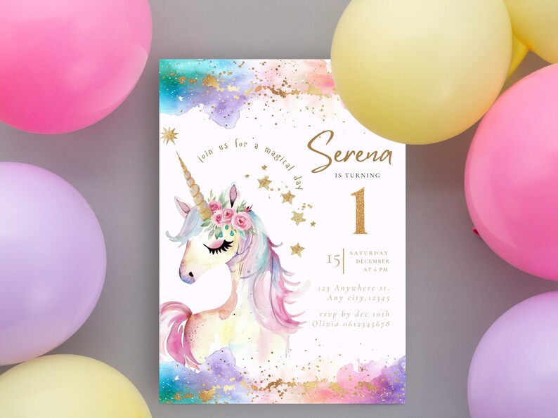 Puede incluir: Una invitaci&oacute;n de cumplea&ntilde;os con un unicornio de acuarela, una corona de flores, detalles dorados y el texto "Serena cumple 1 a&ntilde;o". Globos rosas, morados y amarillos rodean la invitaci&oacute;n.