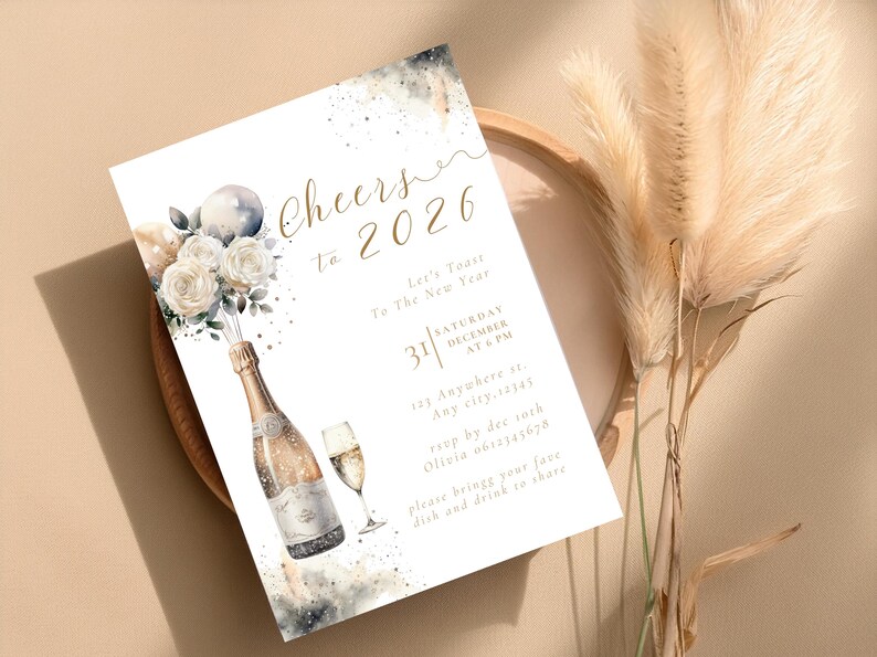 May include: New Year's invitation card with watercolor champagne bottle, glass, and floral accents. The card reads "Cheers to 2026" with event details. The design includes white roses and a balloon.