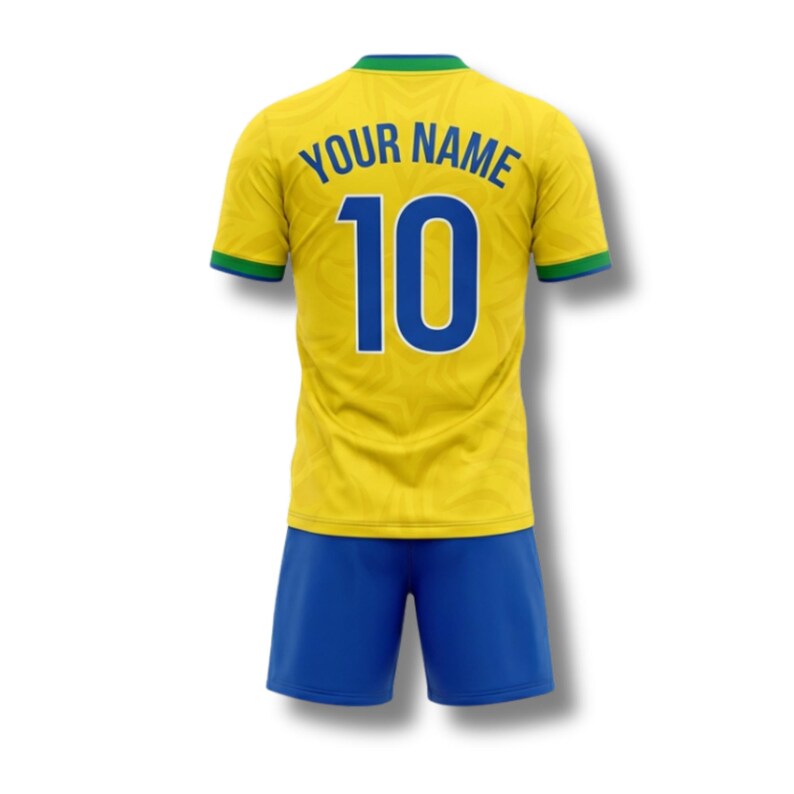 May include: A yellow soccer jersey and blue shorts set. The jersey has the number 10 in blue, with the words "YOUR NAME" above it. The jersey has green and blue trim.