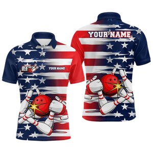 May include: A bowling polo shirt featuring a design of a red bowling ball hitting pins, with an American flag pattern. The shirt has the text "YOUR NAME" and a bowling logo. The shirt is red, white, and blue.